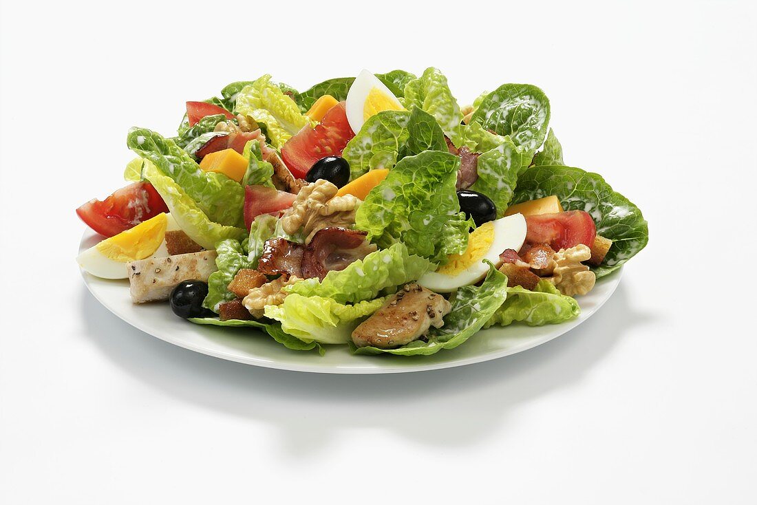 Romaine lettuce with egg, olives, chicken and nuts