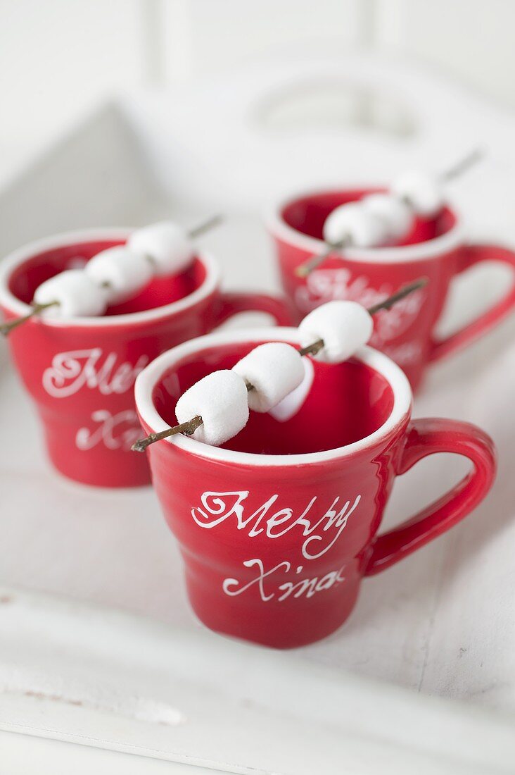 Marshmallows on sticks on red cups (Christmas)