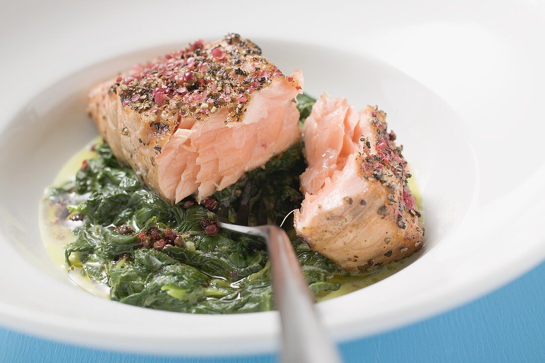 Spicy salmon fillet on spinach