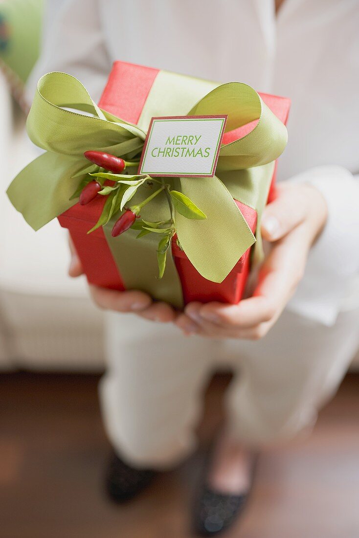 Woman holding Christmas gift