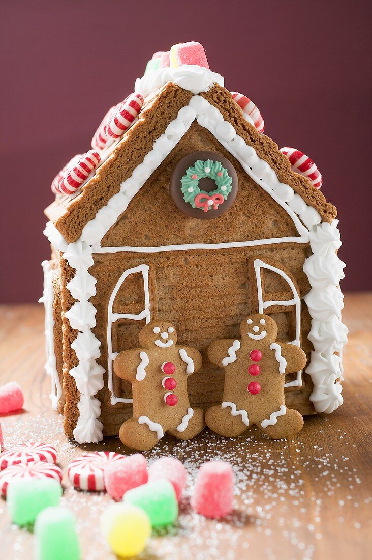 Gingerbread house with two gingerbread men