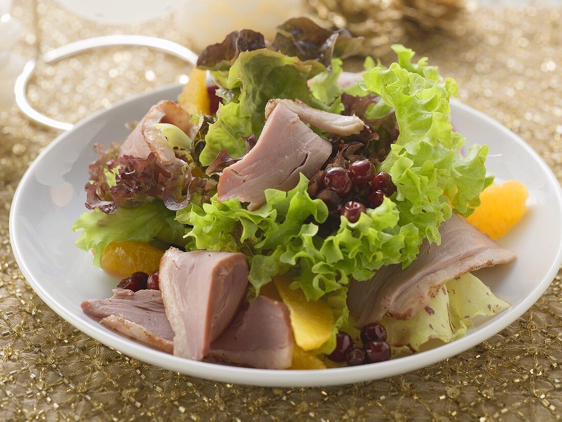 Salad leaves with duck breast and fruit (Christmas)