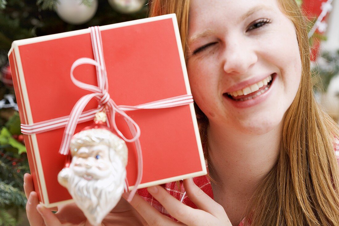 Woman holding Christmas parcel