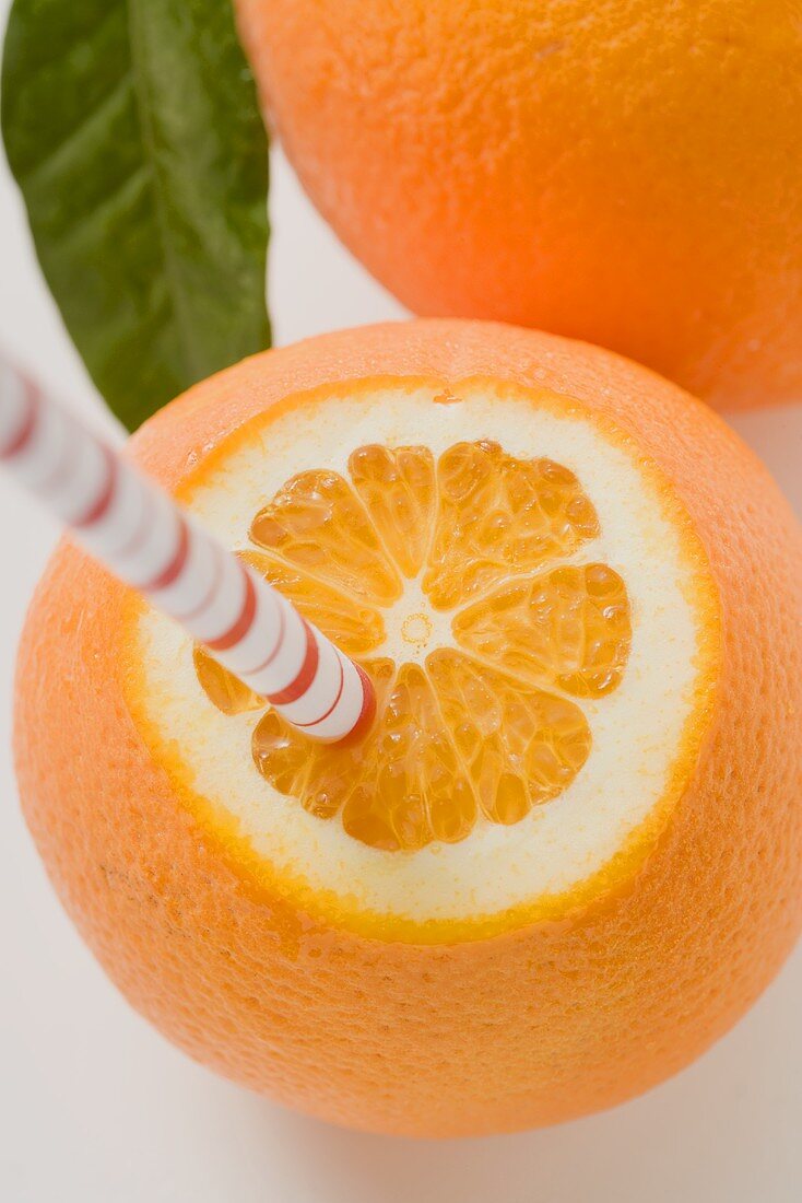 Orange with straw (overhead view)