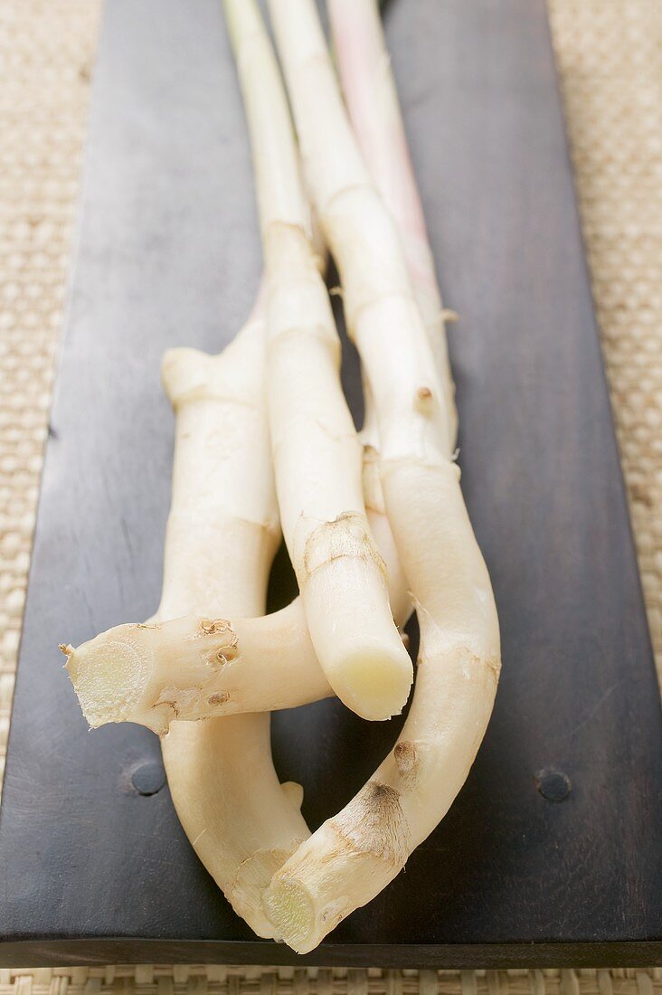 Young ginger on wooden board