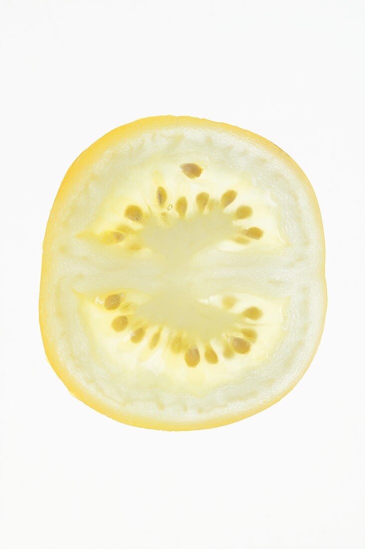 Slice of yellow tomato from above