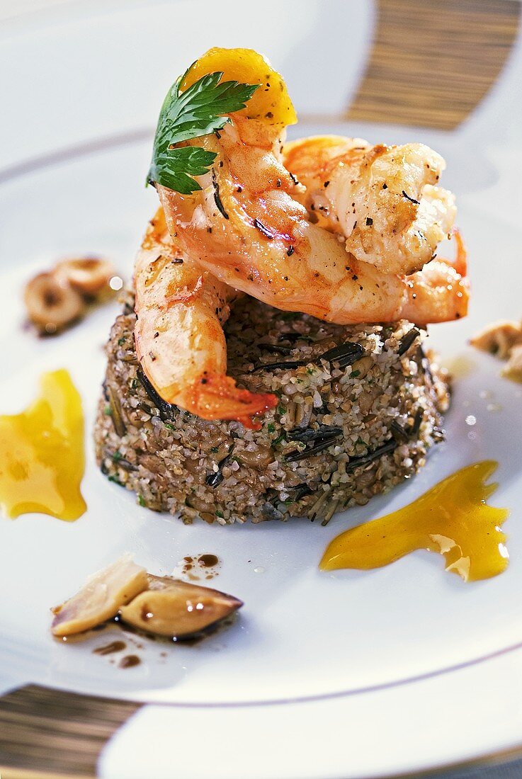 Grilled prawns, three grain couscous and orange sauce