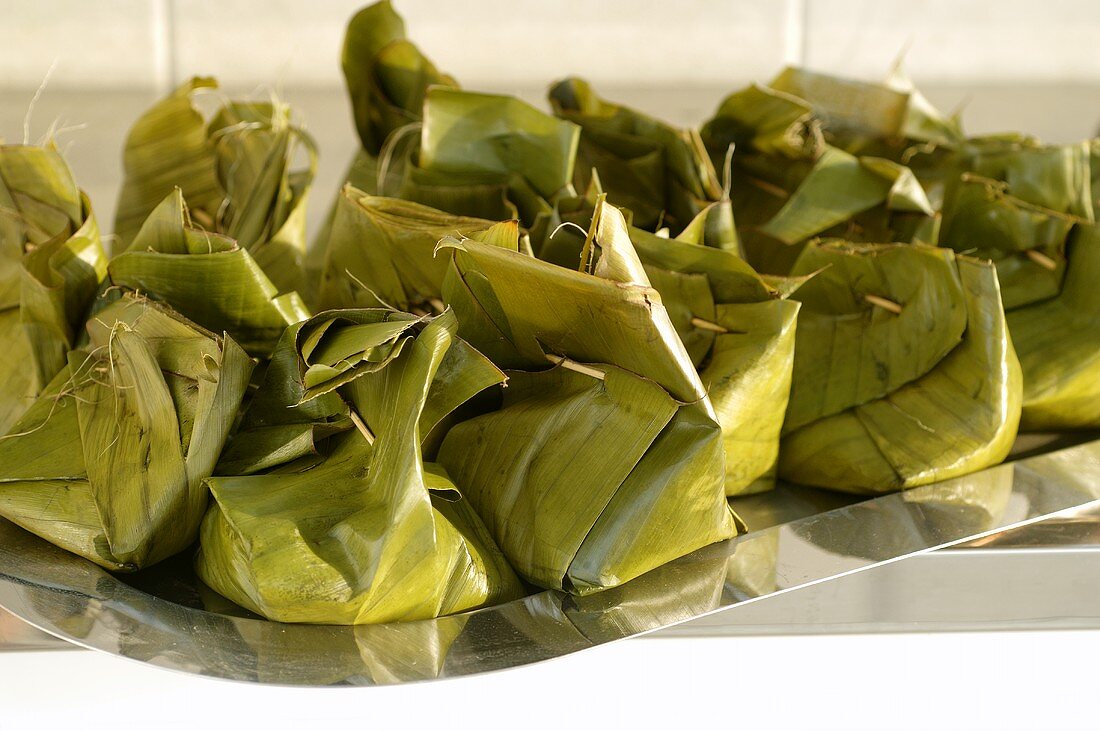 Bamboo and pork in banana leaf parcels