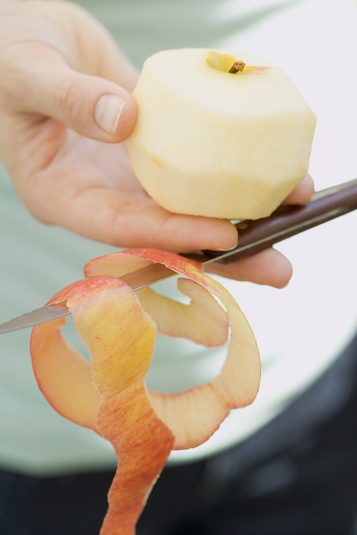 Peeled apple and apple peel