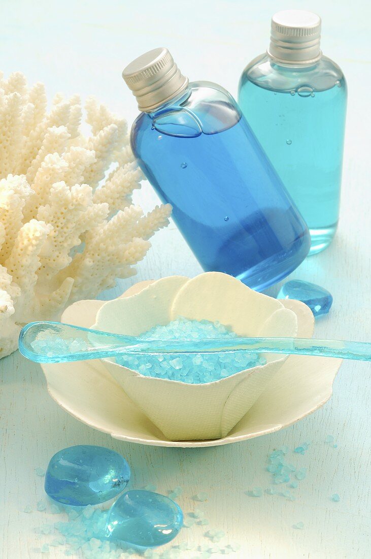 Blue bath salts and bath products in bottles