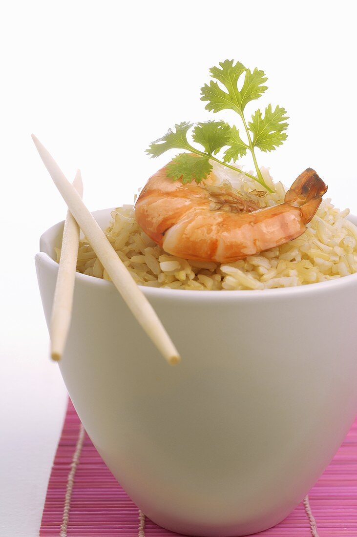 Bowl of rice with prawn and parsley