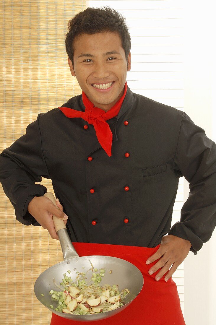 Asian chef with single-handled wok