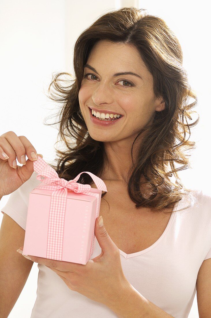 Woman holding gift in her hand