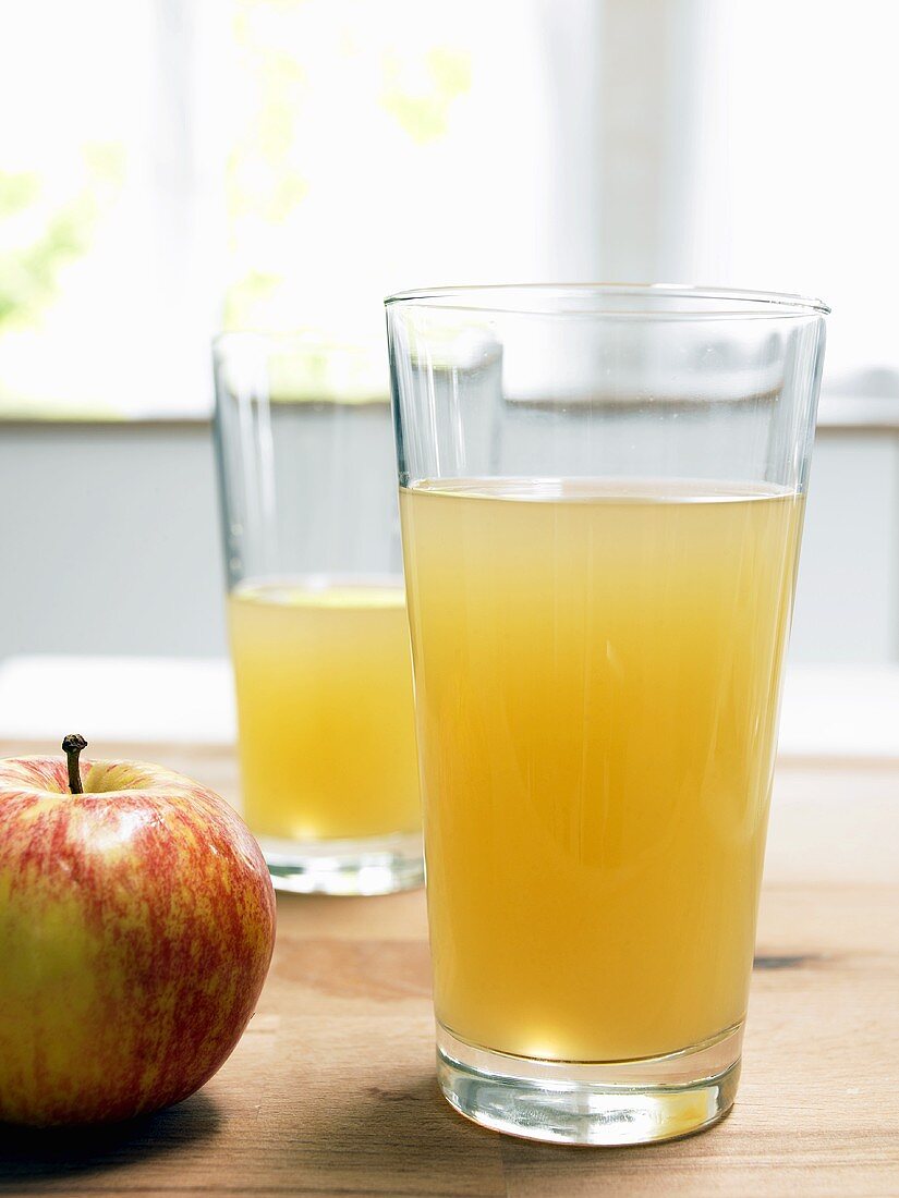Glass of naturally cloudy apple juice