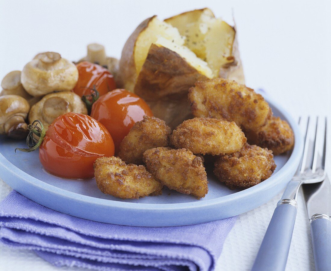 Chicken Nuggets mit Tomaten, Champignons & Ofenkartoffel