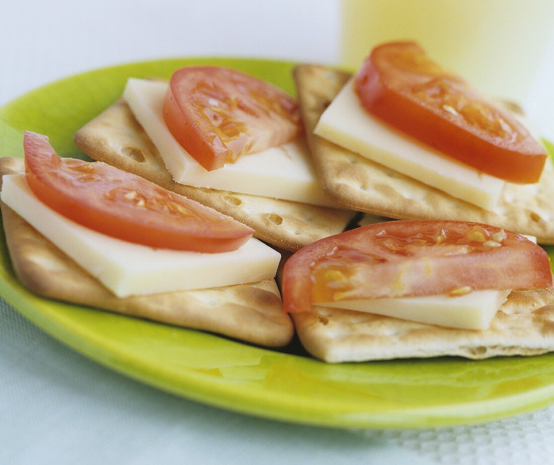 Cheese and tomato on crackers
