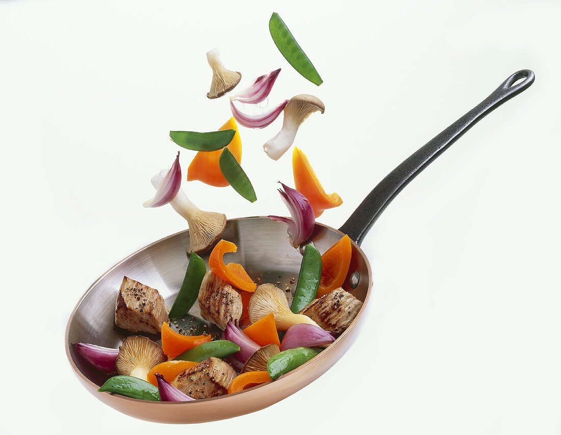 Pork and vegetables in a frying pan