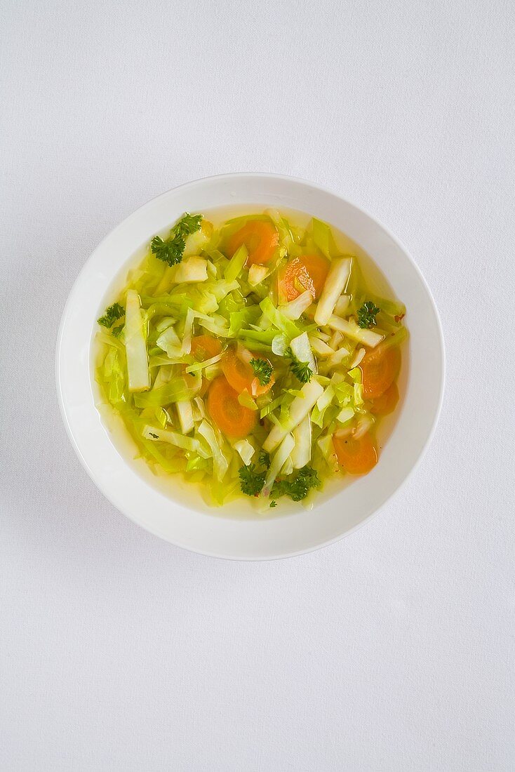 A plate of vegetable soup