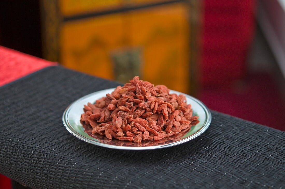 Dried goji berries on a plate