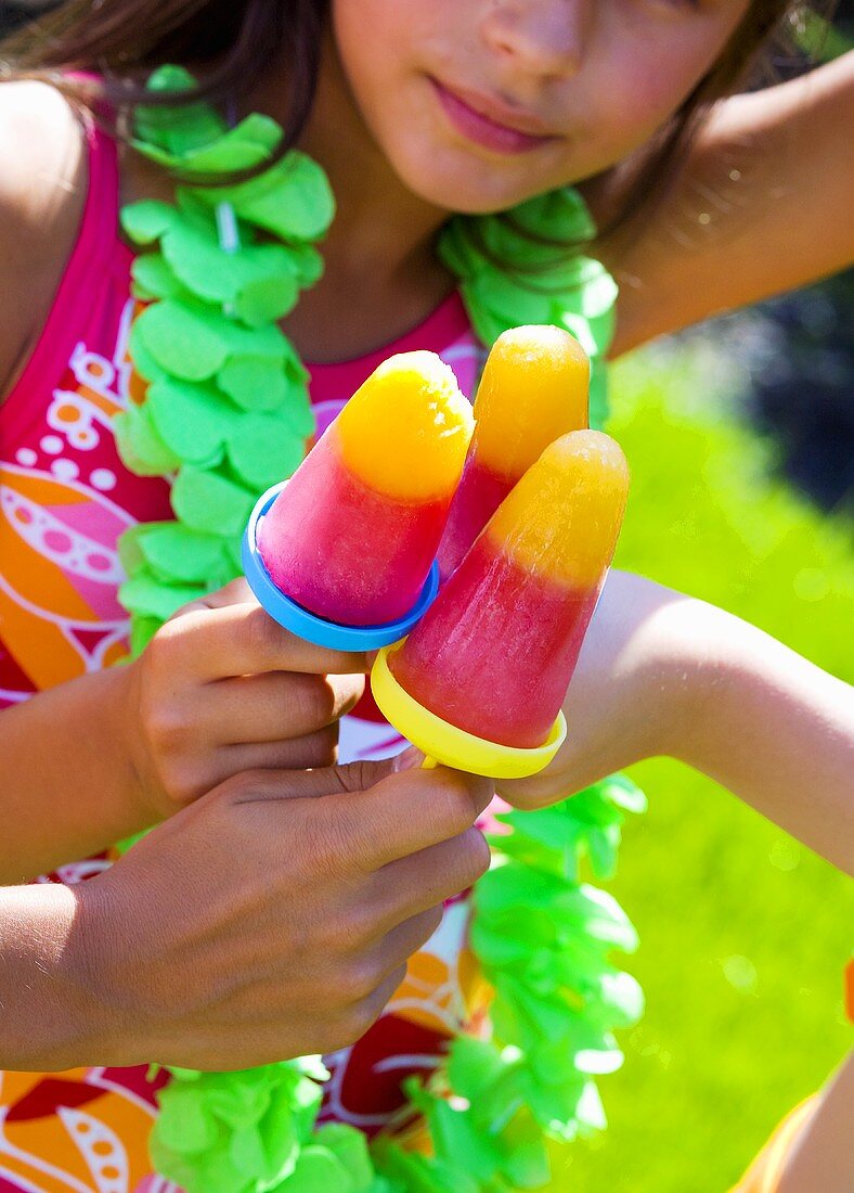 Children with ice lollies at a children's party