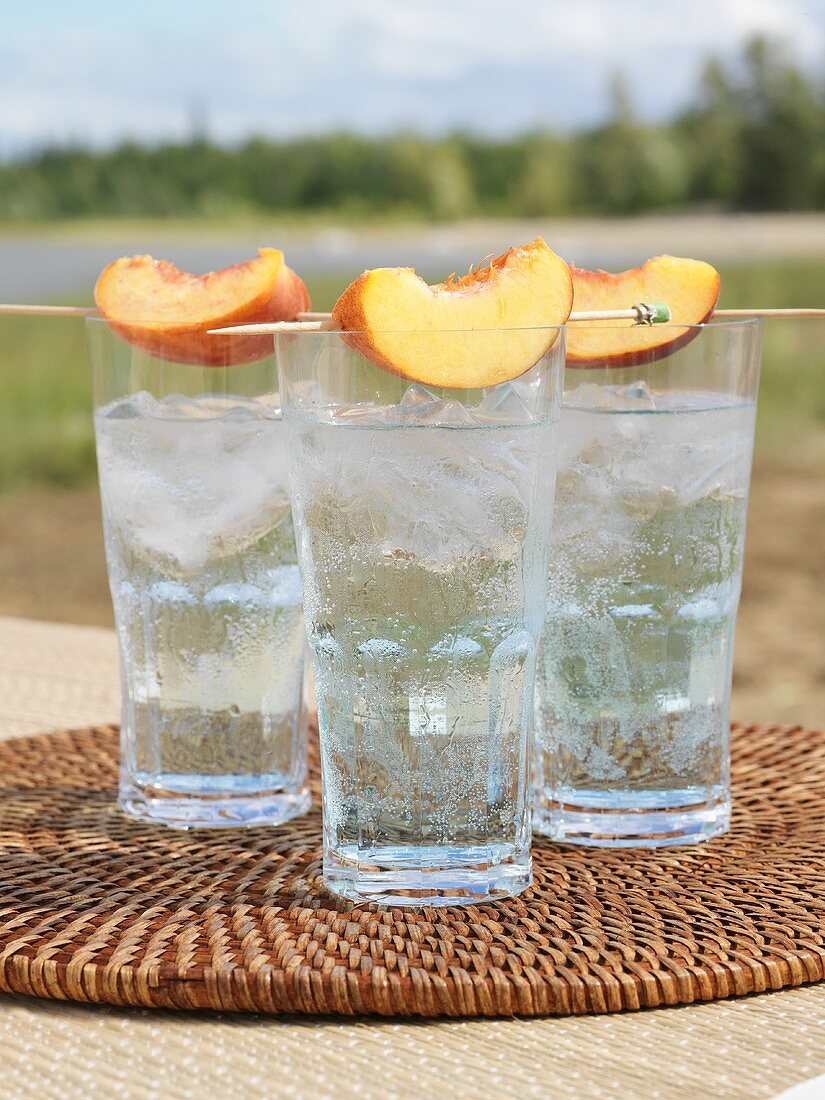 Clear Sailing cocktail with peach wedges