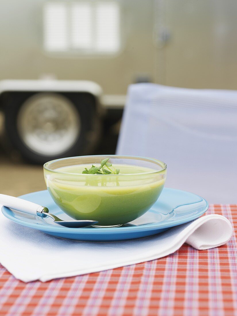 Cream of pea soup in a glass bowl