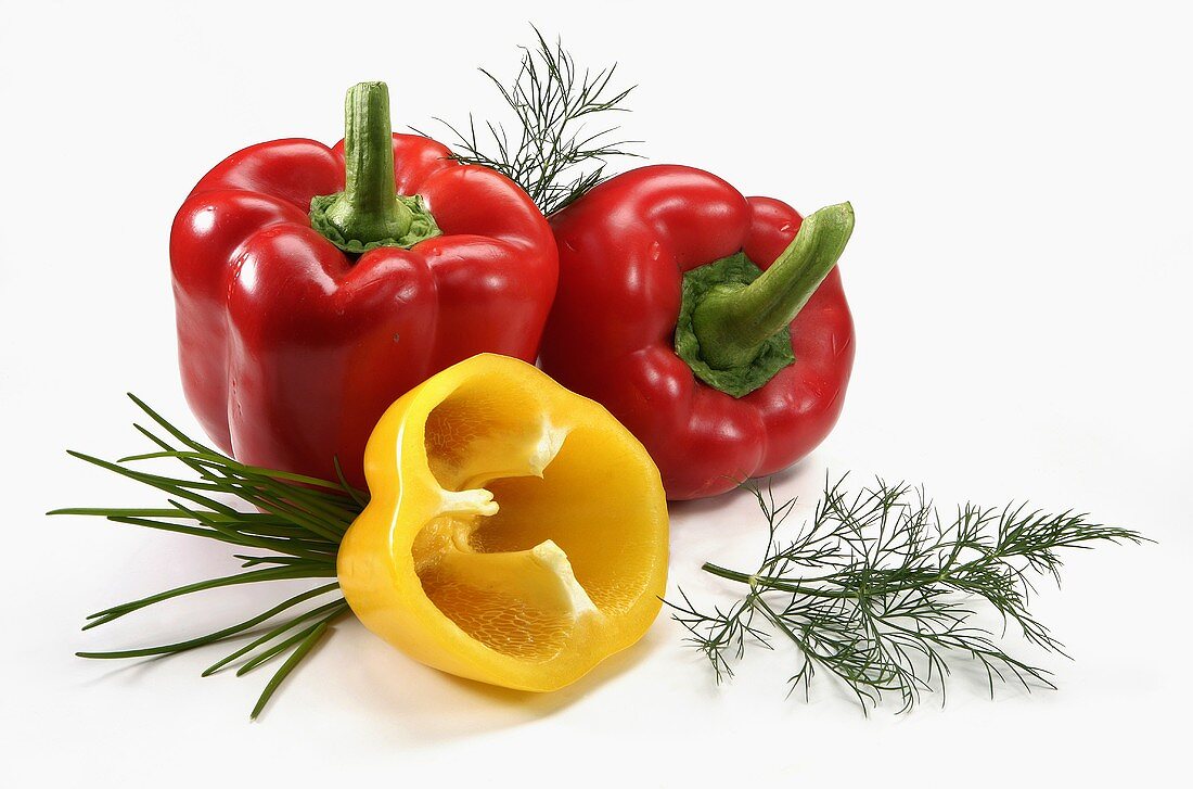 Yellow and red peppers with herbs