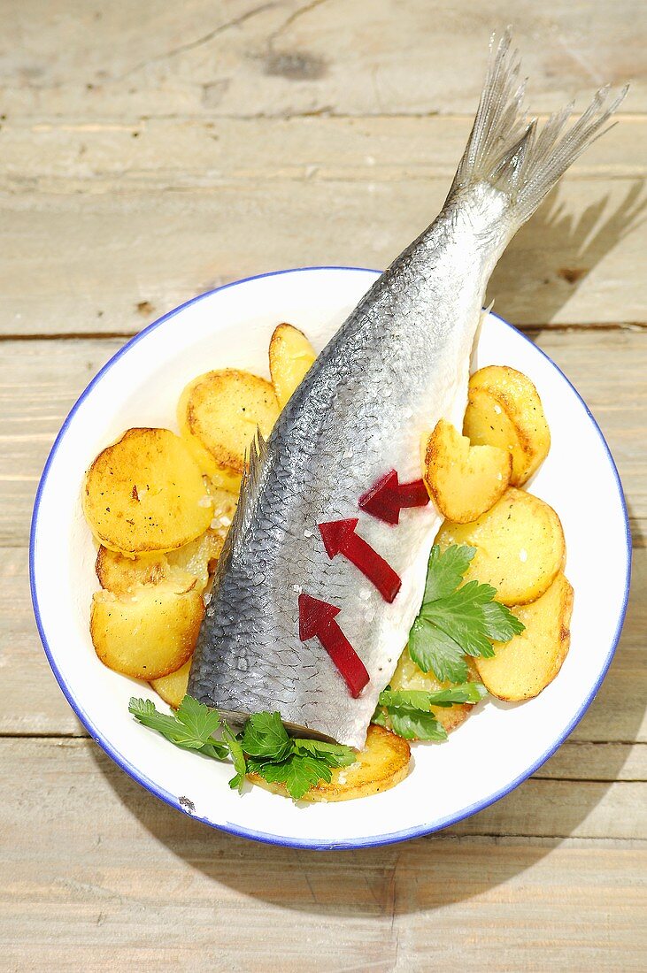 Stuffed pickled herring with beetroot and fried potatoes