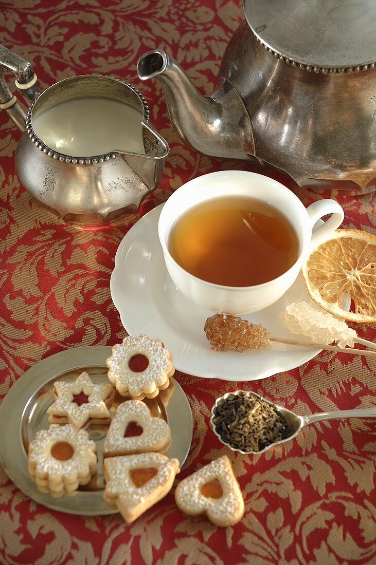 Tea with sugar crystals and biscuits
