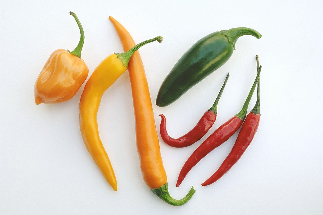 Orange, green and red chillies