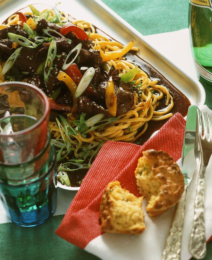 Beef with vegetables on egg noodles