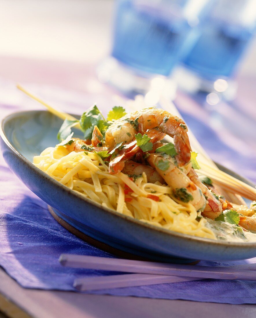 Fried prawns with lemon grass on a bed of pasta