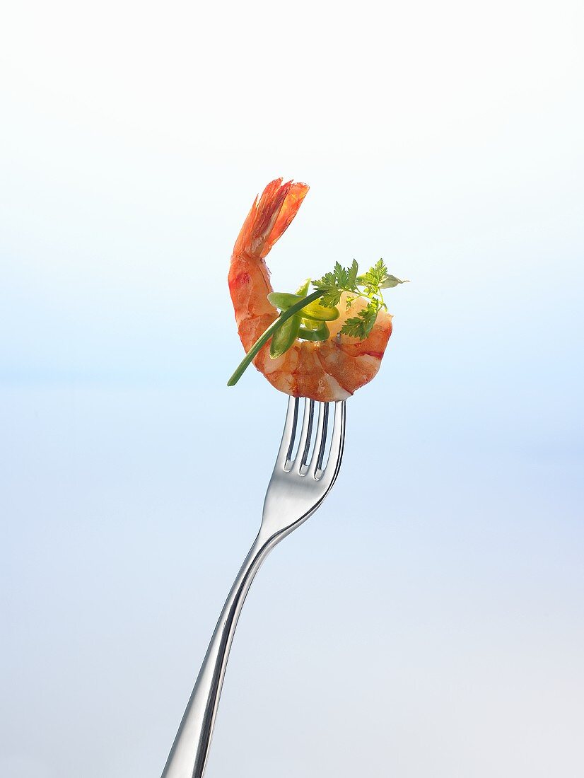 Prawn and herbs on a fork