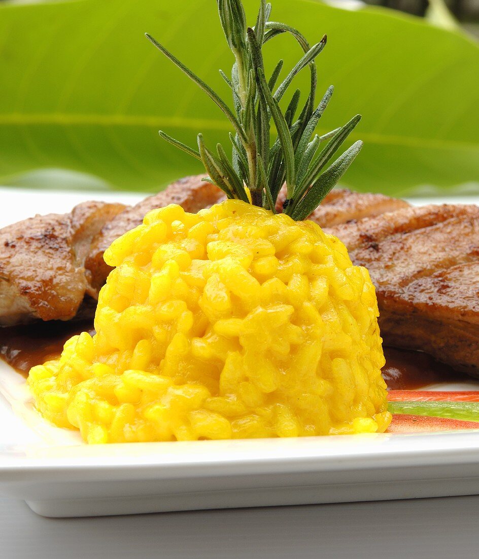 Saffron risotto served with roast duck breast