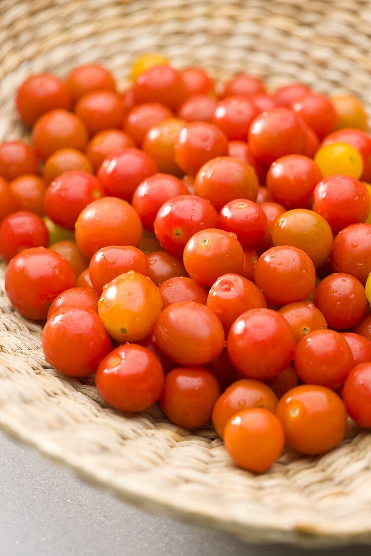 Cocktail tomatoes in a woven basket