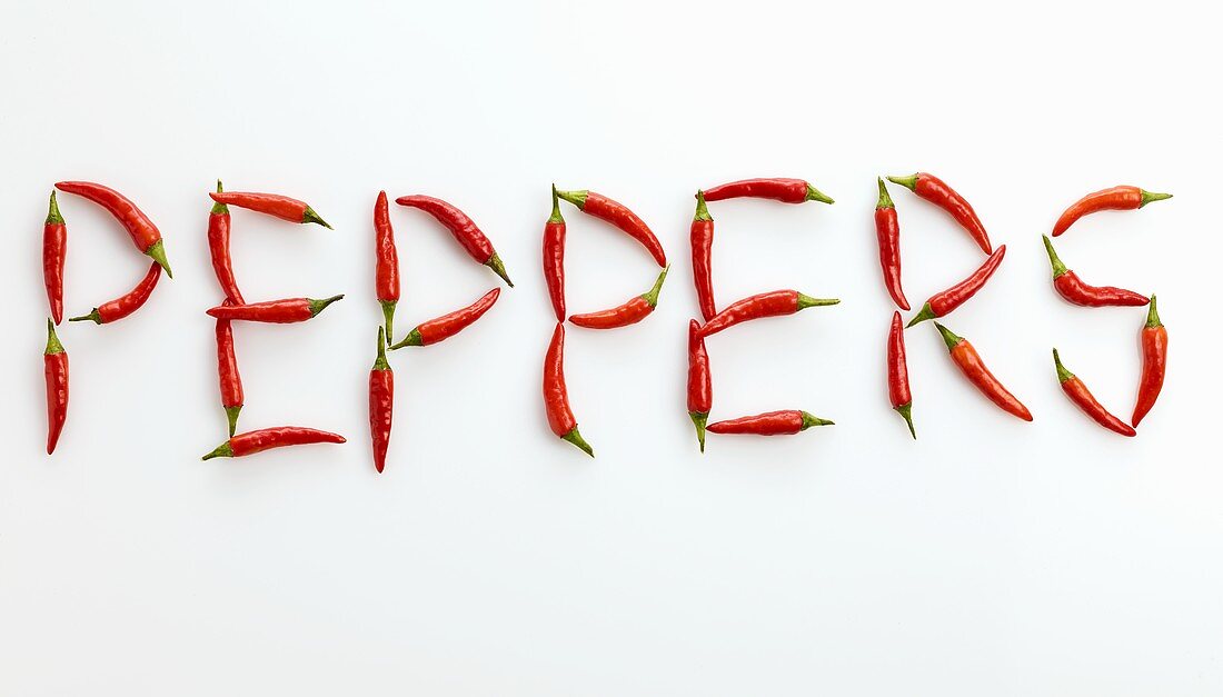 The word 'PEPPERS' written in red chillies