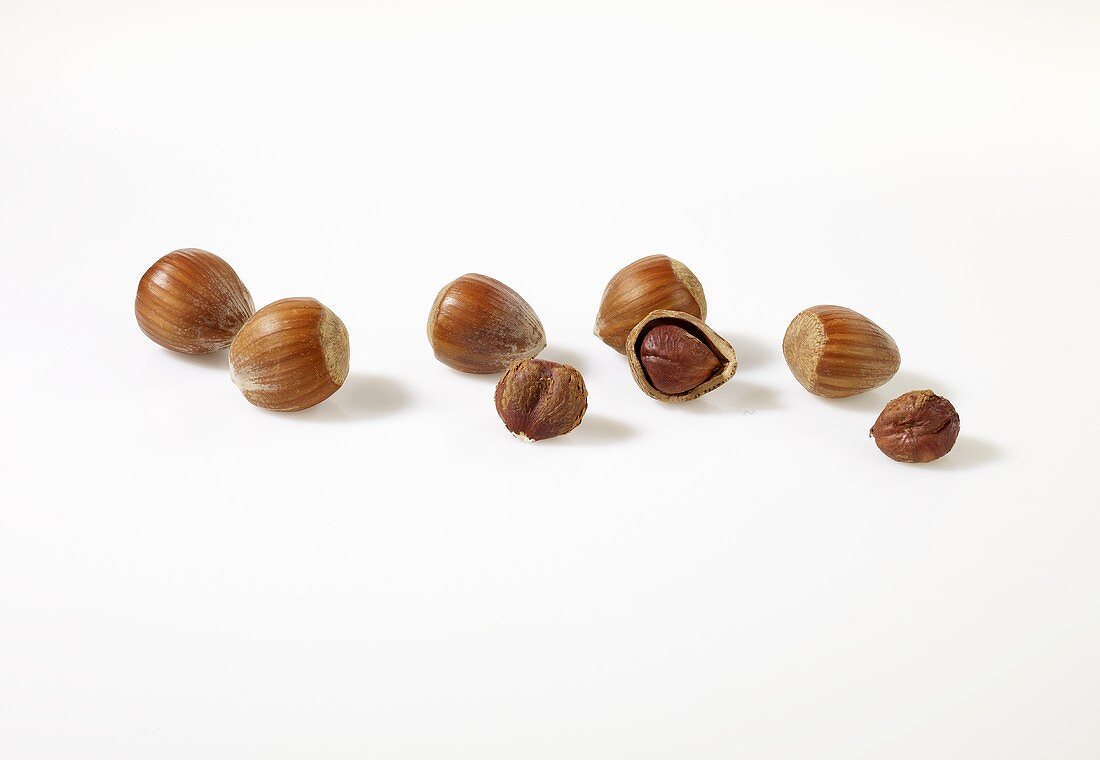 Hazelnuts, unshelled and one shelled
