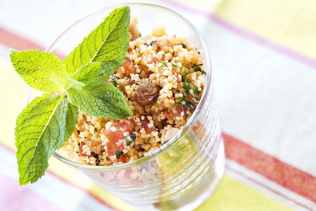 Couscous tabbouleh with vegetables, raisins and mint