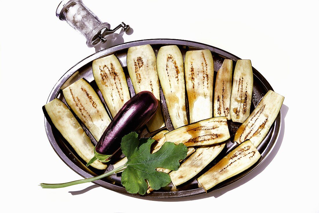 Aubergines being salted to remove liquid
