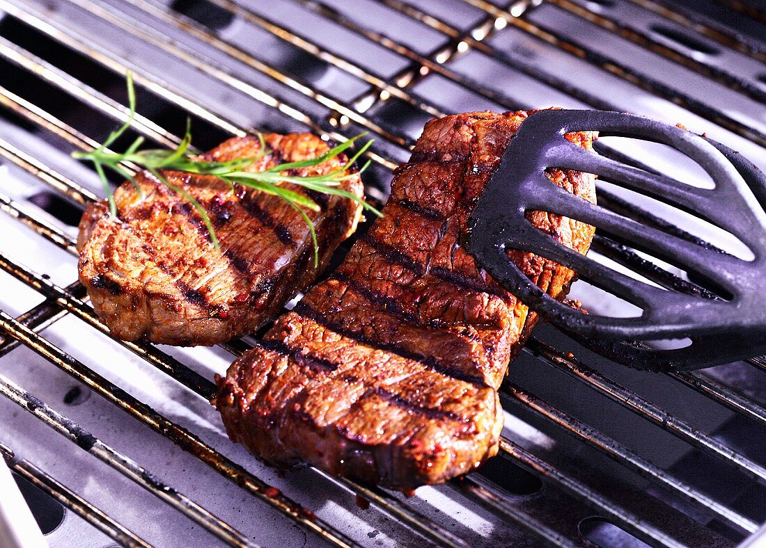Steaks on a barbeque