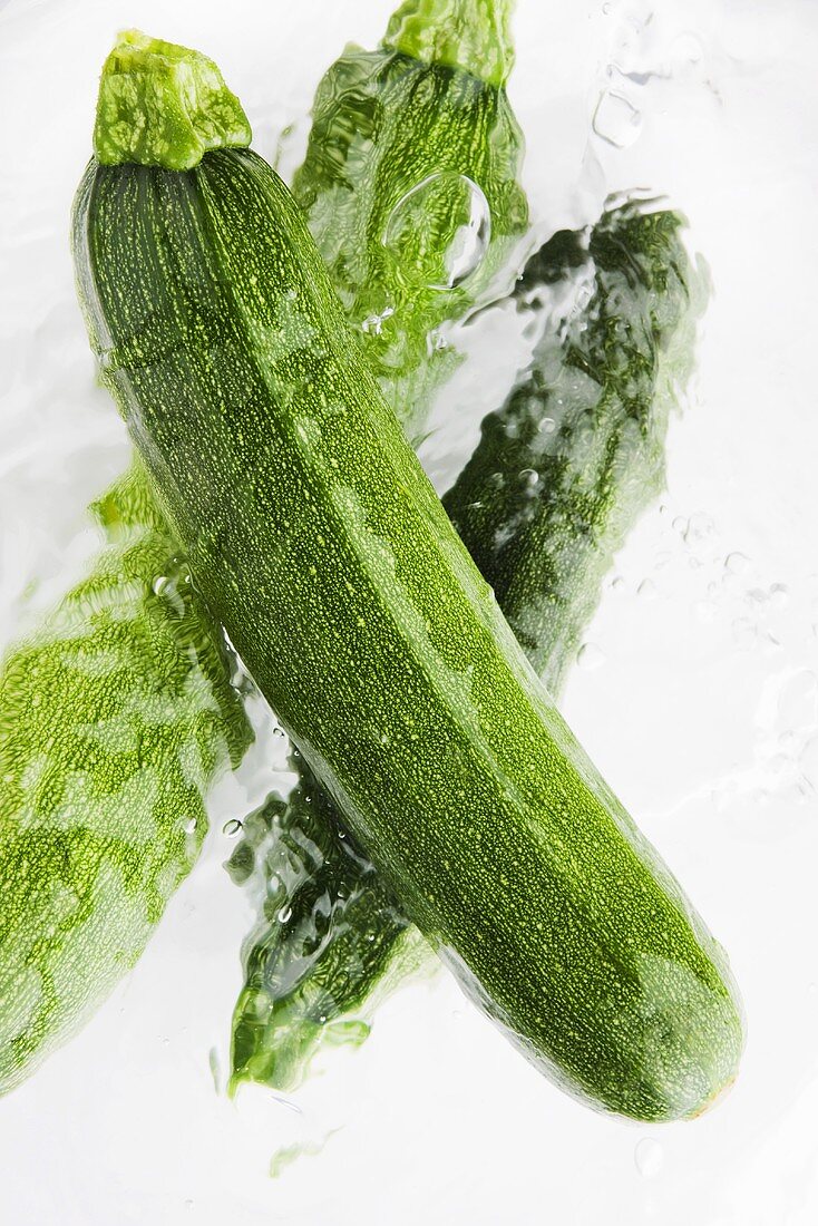Three courgettes in water