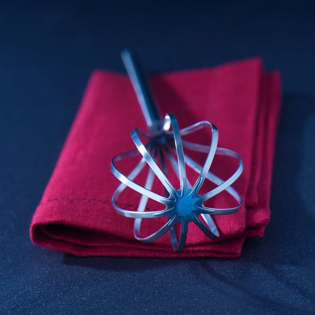 A whisk on a towel