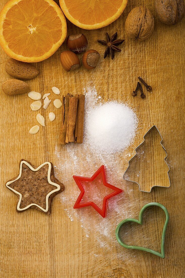 Christmas biscuits, baking ingredients and cutters, seen from above