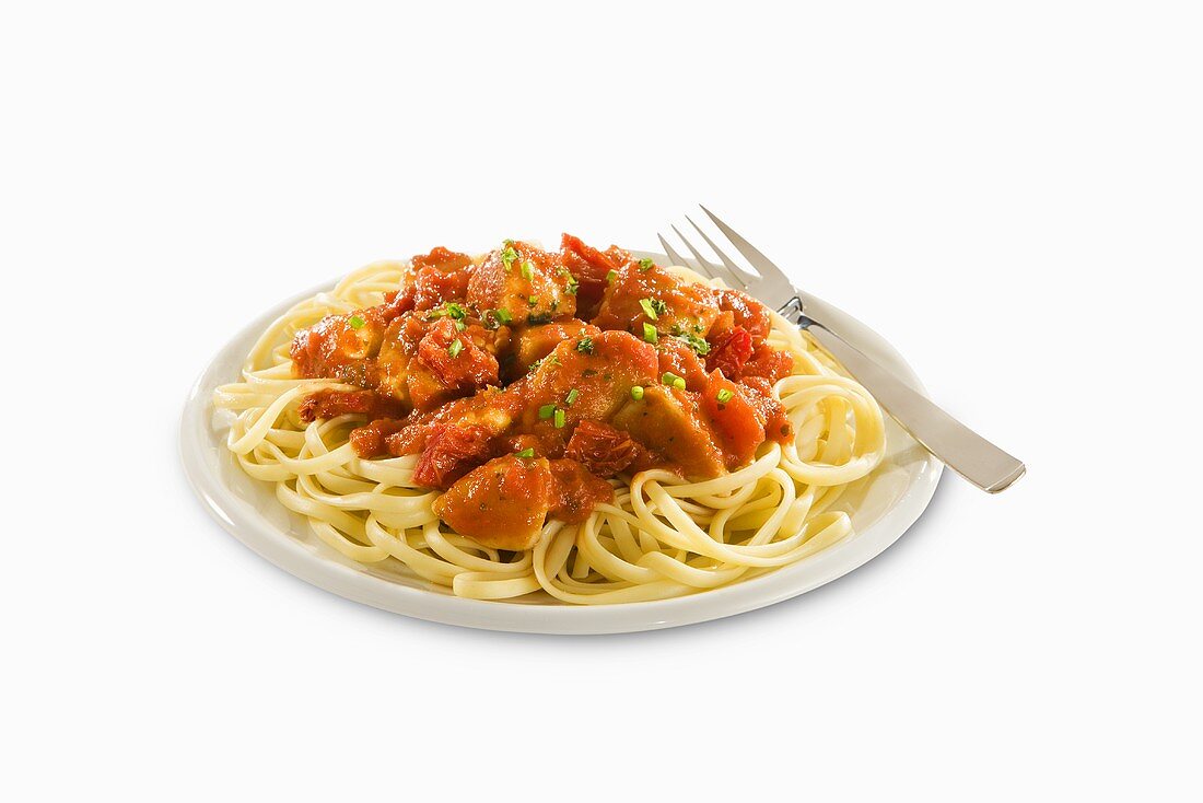 Pasta with Slices Chicken in Tomato Sauce; White Background
