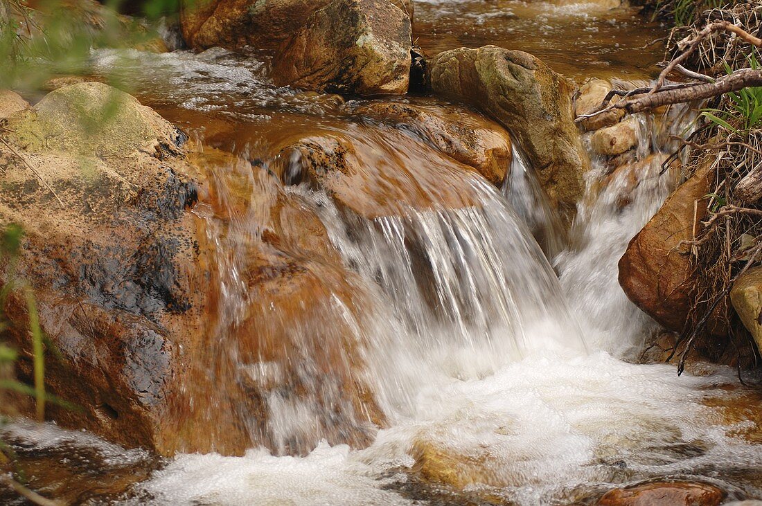 A waterfall cascading into a river