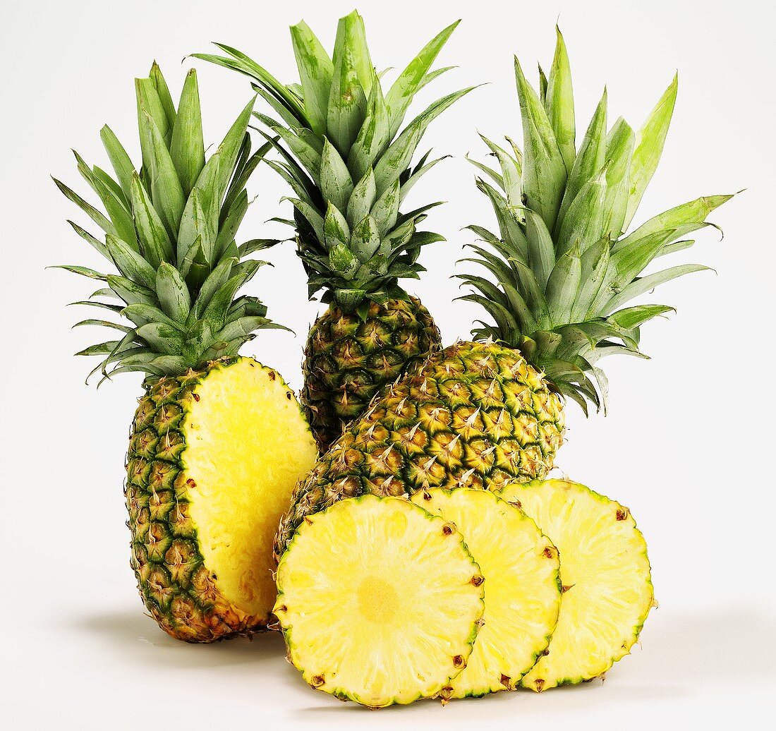 Pineapples, whole, halved and sliced