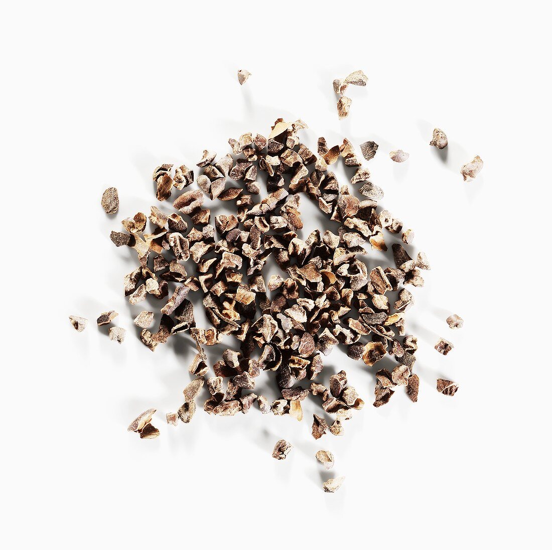 Cocoa nibs on a white surface