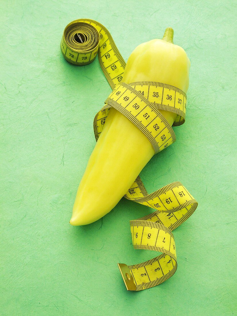 A pointed pepper with a tape measure