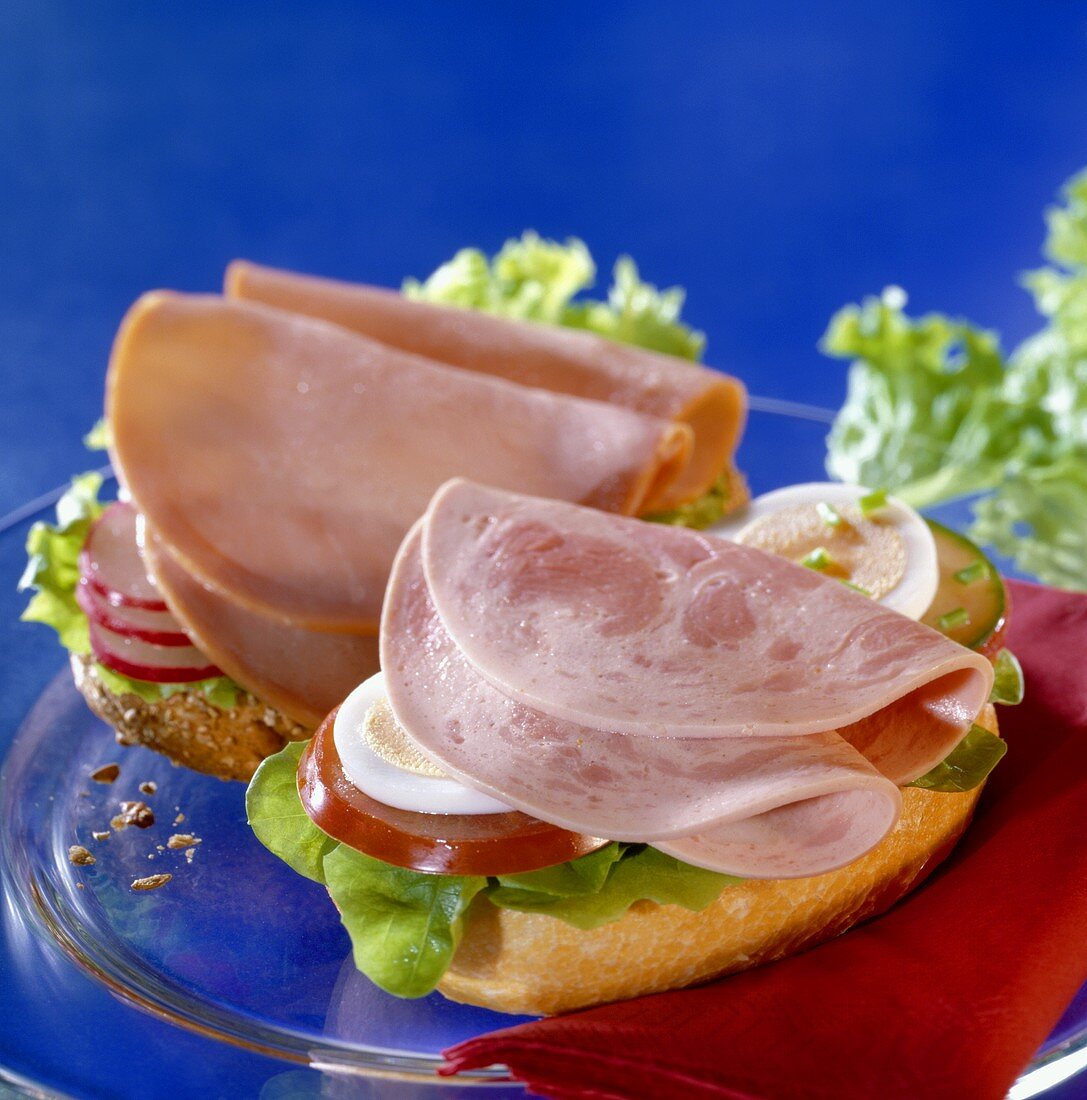 Bread roll halves with cold cuts