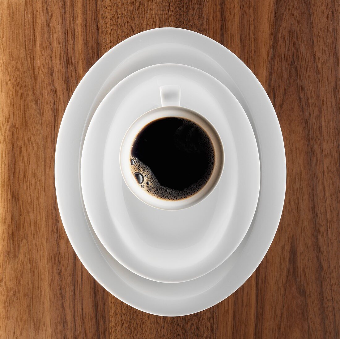 Coffee setting with black coffee on a wooden table